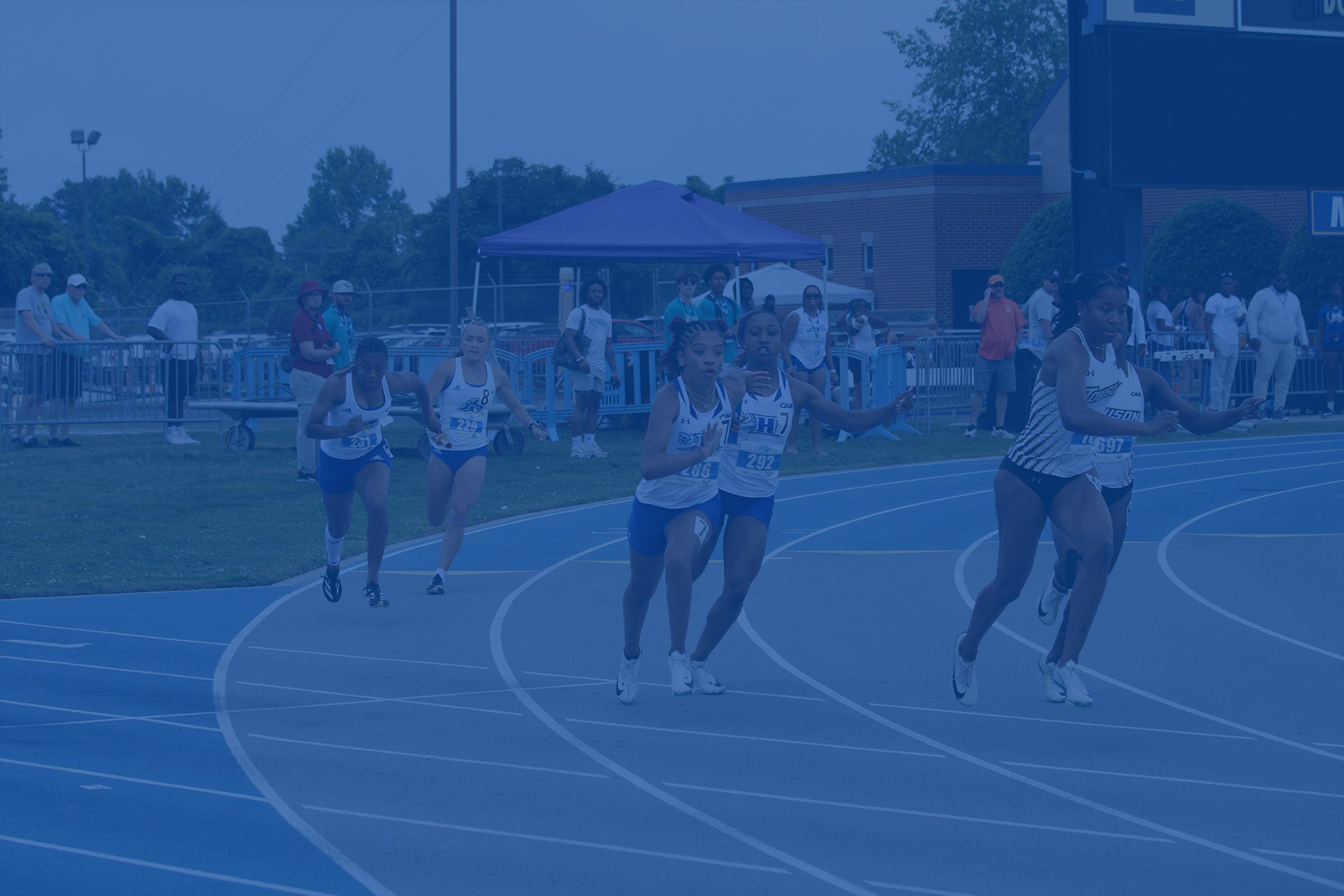 Female athletes running on a track